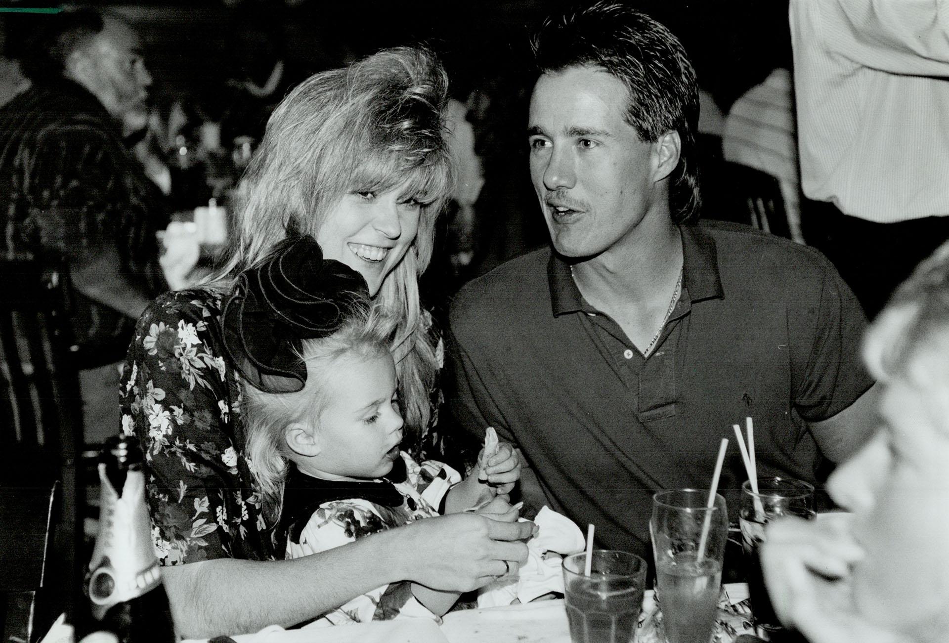 Apres win: Blue Jays catcher Pat Borders, wife Kathy and their daughter  Lindsay, 22 months, enjoy a meal after Toronto clinched a division title  yesterday – All Items – Digital Archive : Toronto Public Library