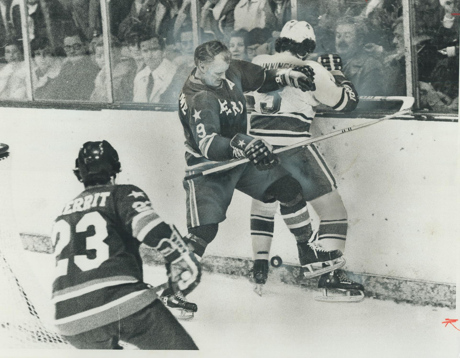 Gordie Howe of Houston Aeros holds Toronto Toros' Rick Cunningham against  boards in WHA action at Varsity Arena last night. Howe was off form in a  5-2() – All Items – Digital Archive Ontario