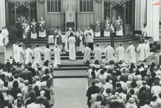 Archbishop Philip Pocock ordains 16 men as deacons in St