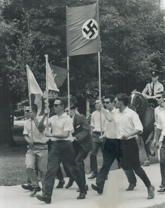 Swastika-Emblazoned banner held high, the little Nazis set off on their Allan Gardens protest march