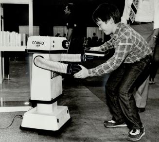 Put'er there, pardner, Jason Lantz's smile suggests he would welcome a robotic buddy - who can talk, as well as vaccum a guy's bedroom and keep watch (...)