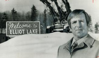 Disabled by lung cancer, Gus Frobel, a former uranium miner in Elliot Lake, stands at the entrance to the town near an old jumbo mining driller. Frobb(...)