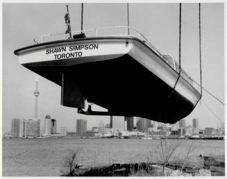 The, Gottwald Container Cargo Crane lifting 22 Tons of Toronto Harbour & Iceland boat Tours, vessel, into the water for the opening of the Tour season, April 25