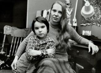 Monique Burchell, with son Damon, 5, says prostitution is implied when it says you should get money from a man when he lives with you