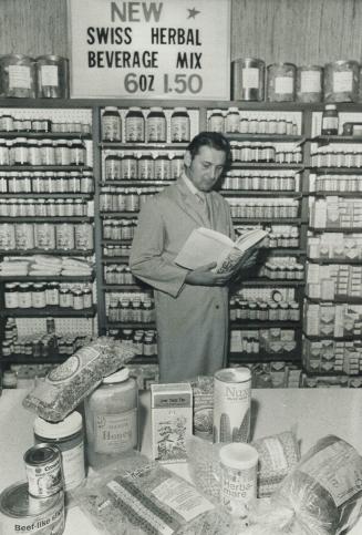 Erwin Zimmerman, manager of a Toronto health food store displays some of the many products bought by consumers who are rejecting modern foods processe(...)