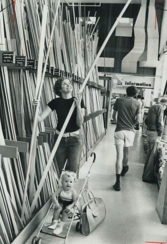 Is this Handywoman? - No, it's Mrs. Debi Cushing, with daughter Dana, buying some lumber at Lansing Buildall's store on Sheppard Ave. E. for renovatio(...)