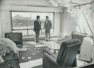 In the Shattered living room of his $55,000 Sudbury home, Marino Giacomini (right) talks with Sudbury Mayor Joseph Fabbro. The ceiling of Giacomini's (...)