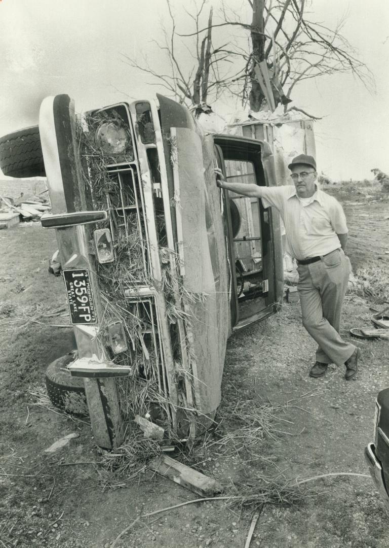 Sad Ross Cleary inspects the ruins of his smashed truck