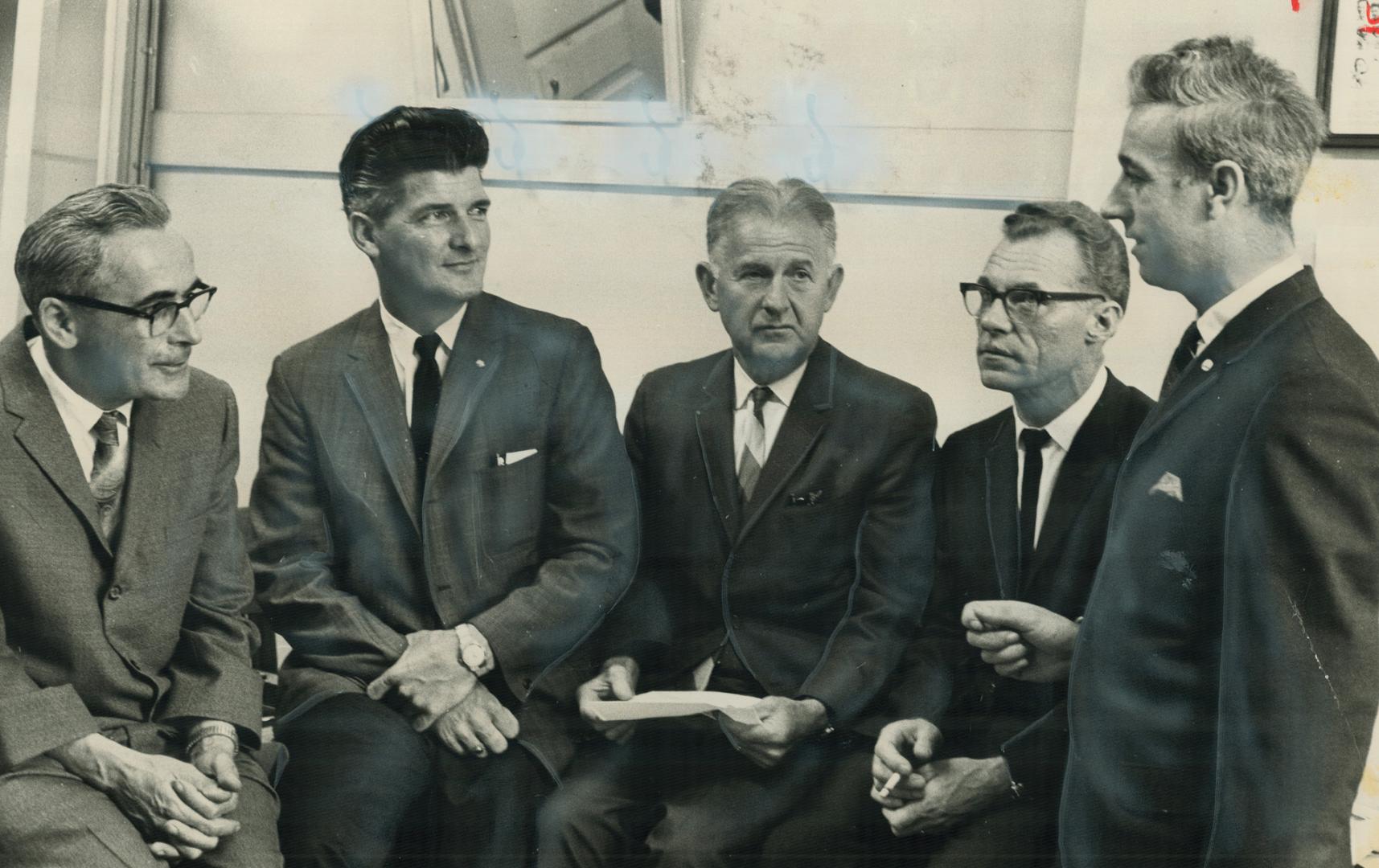 Four convicted pickets talk with textile workers official george watson