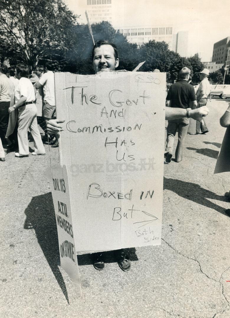 Boxed-in TTC striker Bob Miles uses sign in front of Queen's Park today voicing disapproval as members of the Legislature met to end Metro's 19-day tr(...)