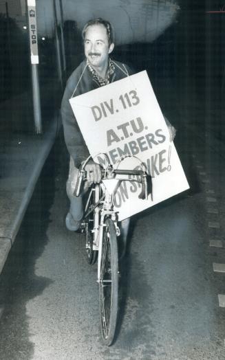 Arriving for Picket Duty - on his bike - TTC driver Herb Dunlop pulls up at Russell Division barns on Queen St
