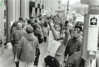 Taking it to the top, Striking employees of the Cambridge Reporter and Guelph Mercury newspapers picket outside the downtown Toronto headquarters of t(...)