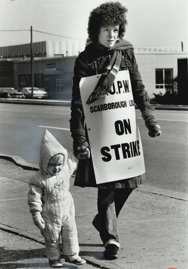 Dianne Fisher pickets with daughter Jennifer, 18 months