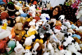 Paws for Hugs, Kim Garreffa, family services co-ordinator for the Salvation Army, looks out over a sea of stuffed bears, bunnies, pupples and other creatures, all dressed in their festive best