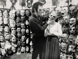 Best face forward: Ed Smitchen, left, and Judy McCulloch try out masks of the great and ghastly at the Toronto Spring Gift show yesterday in the Coliseum at Exhibition Place