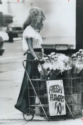 Selling fruit and flowers on the corner of King and Yonge Sts