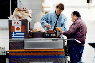 We grill hot dogs and spicy sausages for office workers and tourists around here summer, winter, rain or shine
