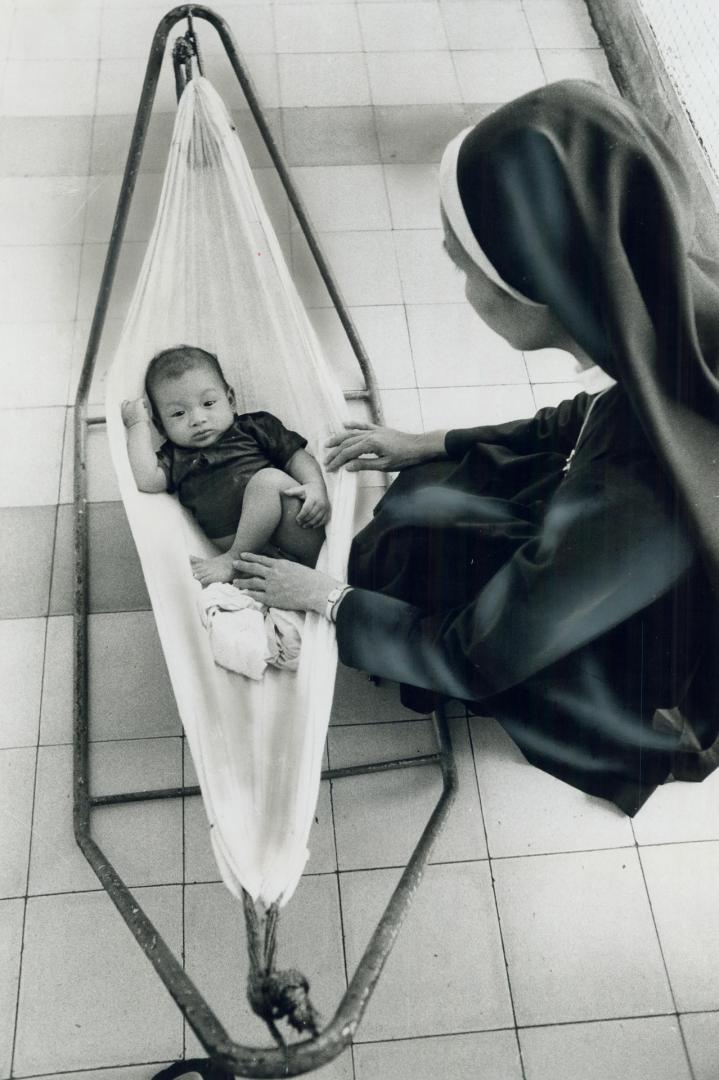 One of the abandoned children in Viet Nam is cared for by nun