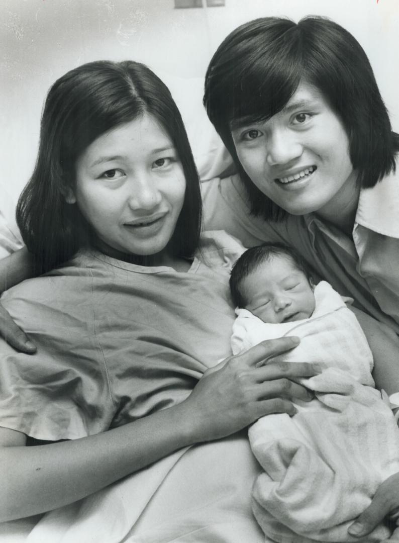 Baby Hung with mother, Kim, and father, Lam