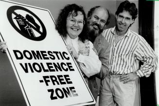 Taking action: Judy Oswin, husband Harry and Grant Smith, right, are members of a co-op committee that has dreamed up a new way to reduce domestic violence