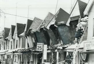 The Roof of five row houses on Bellwoods Ave