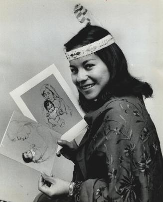 Jeannette Corbiere, Miss Indian Princess of Canada, poses with Christmas cards being sold at Canadian Indian Centre