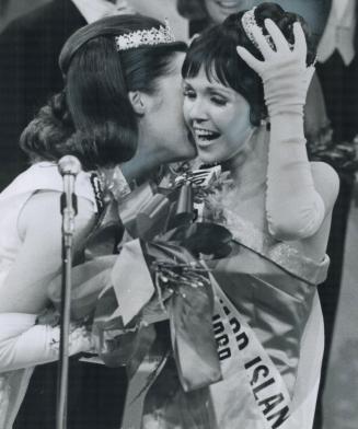 A kiss for Miss Canada, New Miss Canada Carol MacKinnon, 19, of Summerside, P
