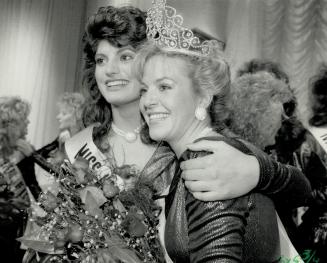 Miss Canada is from London, Melinda Louise Gillies, Miss London, happily poses as Miss Canada 1988 with another contestant after her crowning last nig(...)