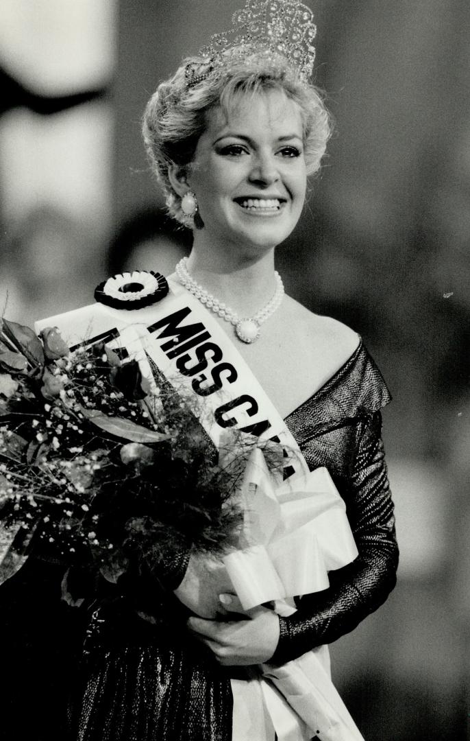 Miss Canada is from London, Melinda Louise Gillies, Miss London, happily poses as Miss Canada 1988 after her crowning last night in Toronto. The 22-ye(...)