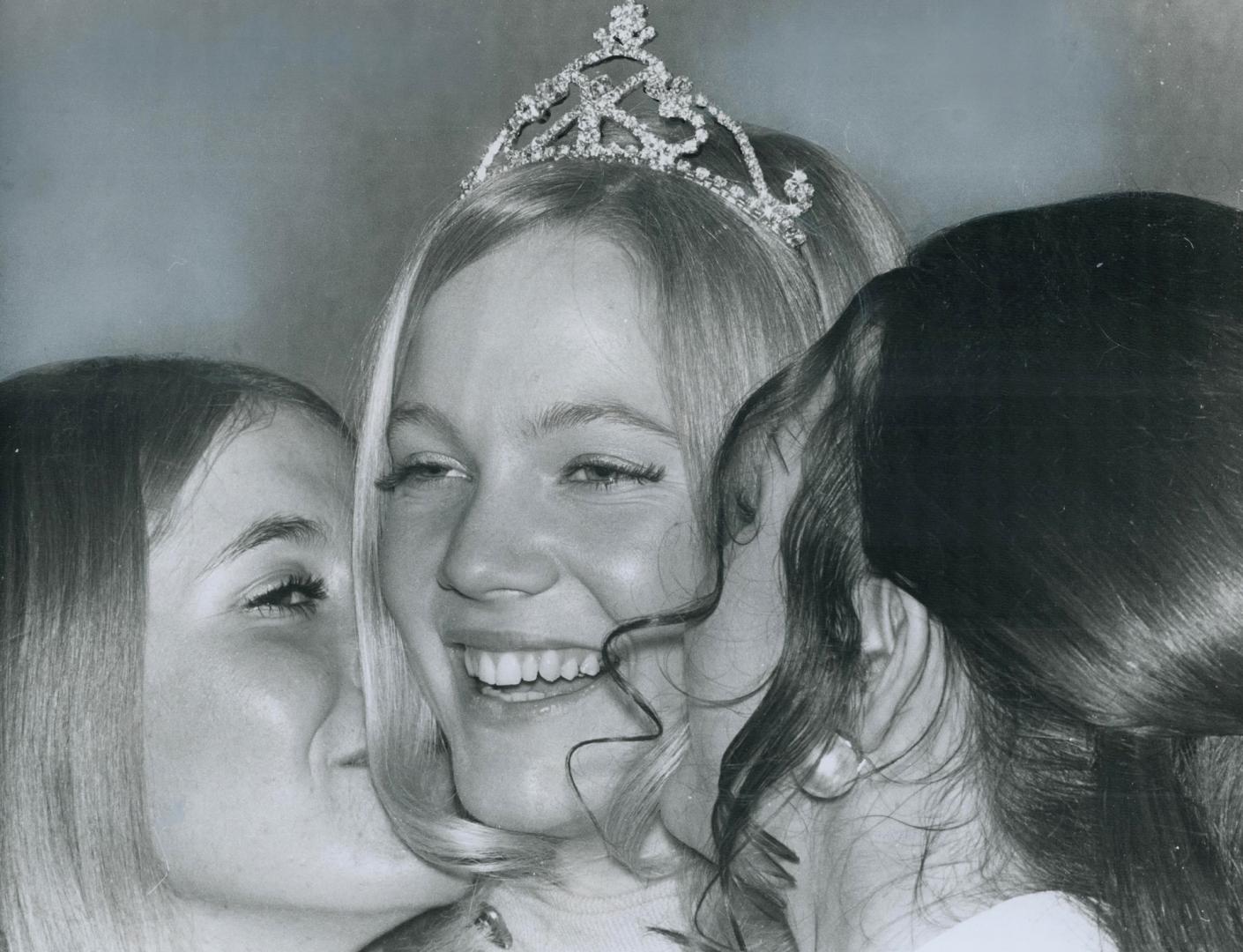Everyone loves a winner, including the losers, and so this year's Miss Grey Cup, Nancy Durrell, gets kisses from Anita Urschel, Miss Edmonton Eskimo, (...)