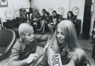 Janice Boyd, Miss Argonaut of Toronto, takes time out for beauty, She gets her long hair trimmed, then braided and curled in the back by Michael Victor