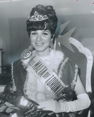 Metro's Maltese crown a queen, Smiling happily, 22-year-old Monica Scannura sits on throne after being crowned Miss Malta, 1970, during third annual M(...)