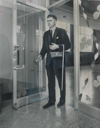 Electronic 'White Cane', White cane hangs loosely over the arm of Graham Stoodley as he tries out new ultrasonic aid which spots obstructions seven fe(...)