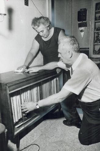 Beulah Fraser admires the record cabinet her husband made for her