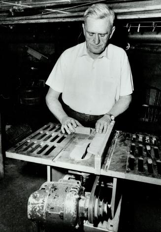 Lloyd Fraser at his carpentry work, The blind man won a city award for excellent woodwork