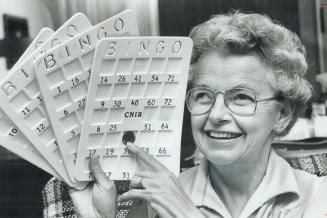Braille bingo cards are held by Hazel Jarvis of Mississauga who heads Peel Association for the Blind