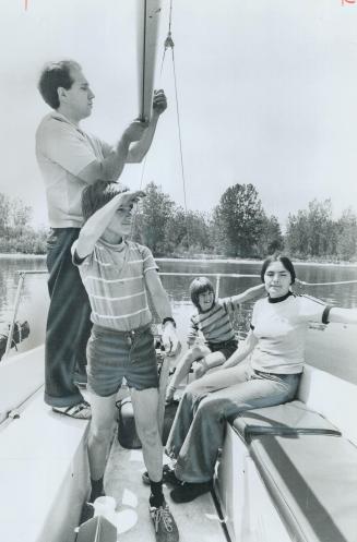 Blind sailor Stan King and his wife, Shirley also sightless, enjoy a day's sailing with sons Stephen, 12, and Michael, 9. King handles the sails himse(...)