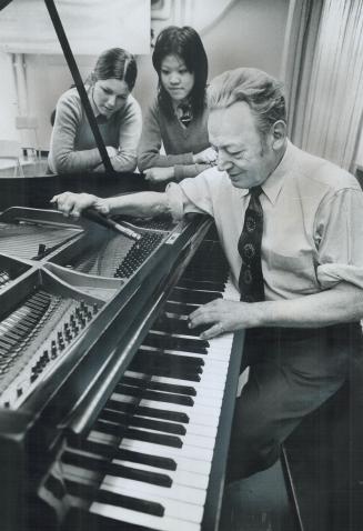 Blind Piano Tuner Bill Metcalfe, 70, tunes a grand piano at Bishop Strachan School