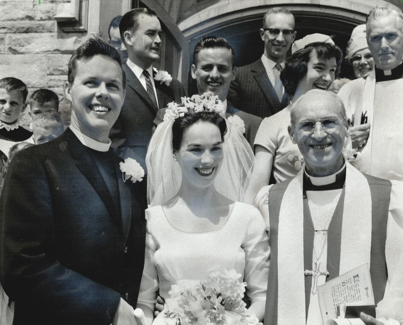 Rev. and Mrs. Philip Rowswell leave St. Timothy's Anglican Church with the bride's father Rt. Rev. H.H. Marsh, bishop of Yukon, who officiated at cere(...)
