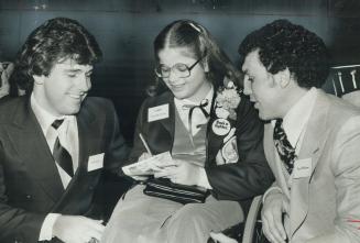 Nadia de Franco signs autograph for Rick Bosetti, left, of Blue Jays and Leafs' Tiger Williams