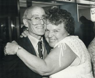 Arthur Middleton gets a joyful hug from niece Jean Bates who started searching for him