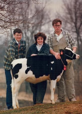 Endangered breed: University of Guelph students John Holtrop, left, Teresa Sheardown and Mark Mitchell plan to stick with agriculture through good times and bad