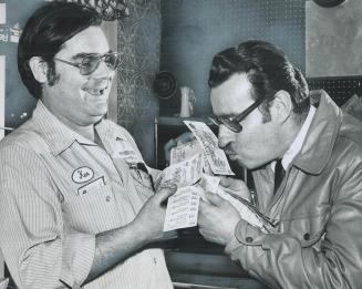 A relieved man, Joe Caisse kisses the sheaf of 30 Provincial lottery tickets -- worth $150 -- that he left in Fairview Mall post office after copying (...)