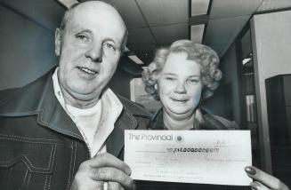 NT Millionaires, Leonard and Bertha of Hamilton show $1 million cheque won in Day Provincial lottery draw