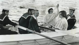 Something borrowed . . . for the occasion, six Sea Cadets from HMCS Haida row the bride-to-be, Darlene Paquette (waving), her bridesmaid, Pearl Gonder(...)