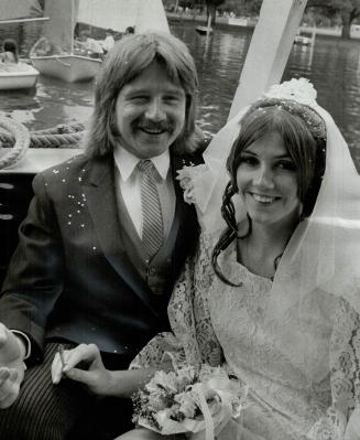 They tied the knot nautically, Mr. and Mrs. John Ellis are pictured aboard a boat which took them to their wedding reception yesterday after their marriage