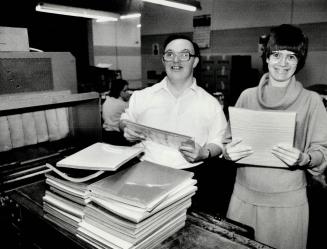 New workplace: Mary Mastromatteo and Crawford Noble, employees of Central ARC Industries, stack paper into shrinking tunnels at their new workplace in Scarborough