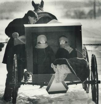 Mennonites mark a simple Christmas, Mennonite children sit bundled in the back of a carriage as they prepare for a winter journey to attend a Sunday s(...)