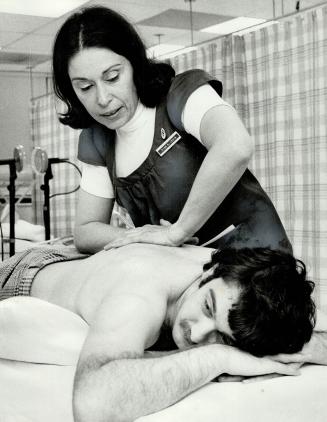 Physiotherapist Goldie Lewis works with patient