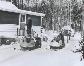 Snowmobiles, operated in pairs, enabled the Ontario Provincial Police to keep watch over cottages in the winter